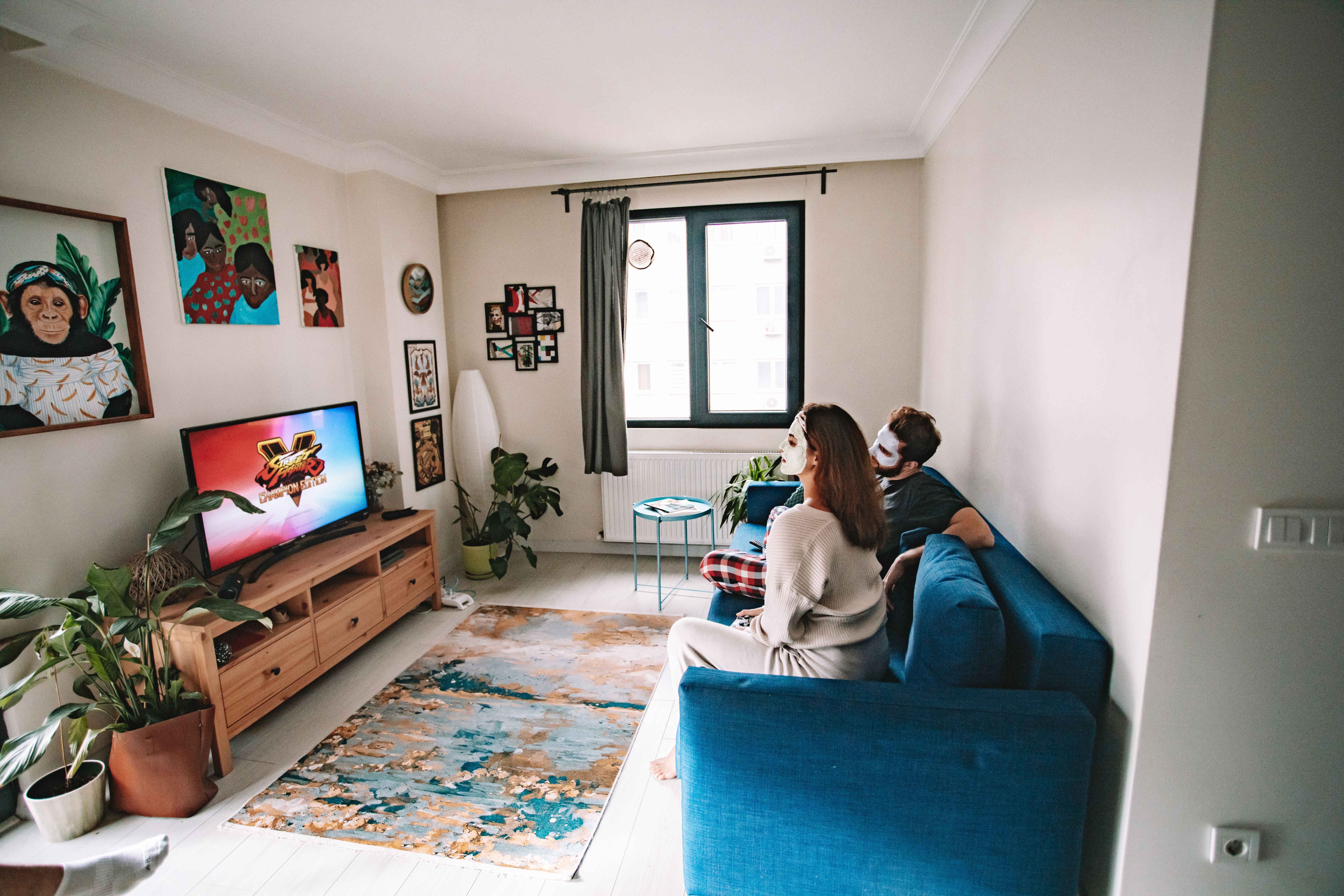 viewer enjoying HD and 4K IPTV content on a large screen television at home
