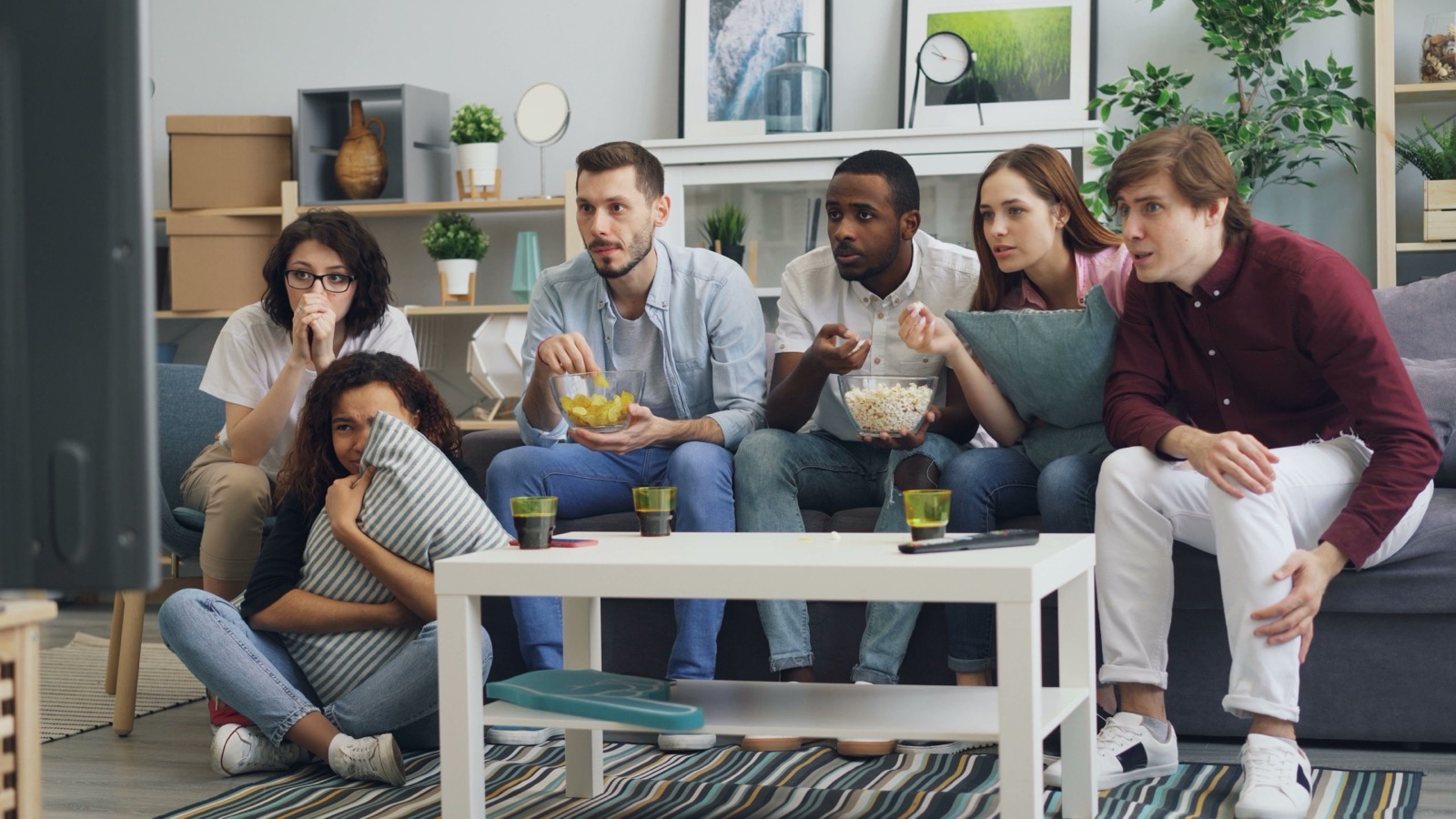 Family watching Crown IPTV alternative on a large living room TV