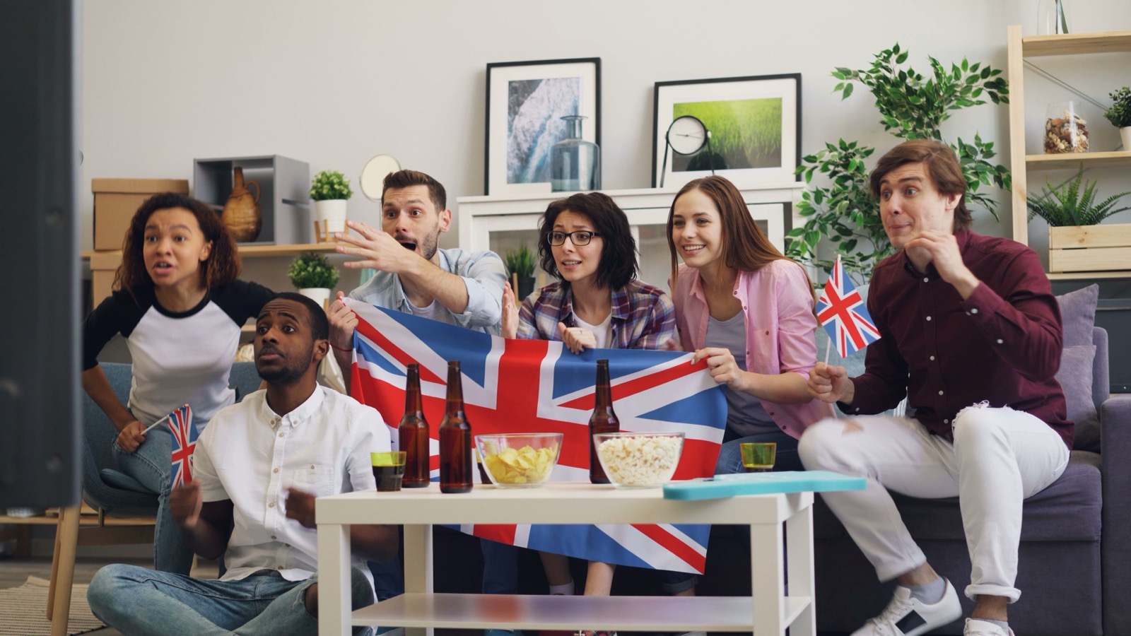 Group of sports fans watching a live match on IPTV with HD streaming quality