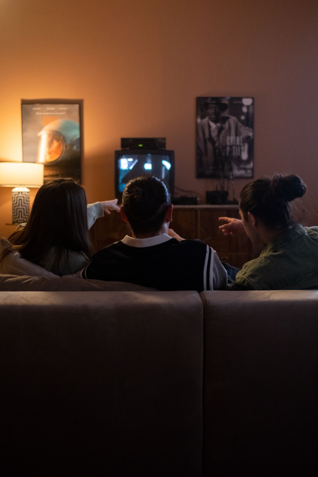 Person streaming IPTV Netherlands content on a modern smart TV at home