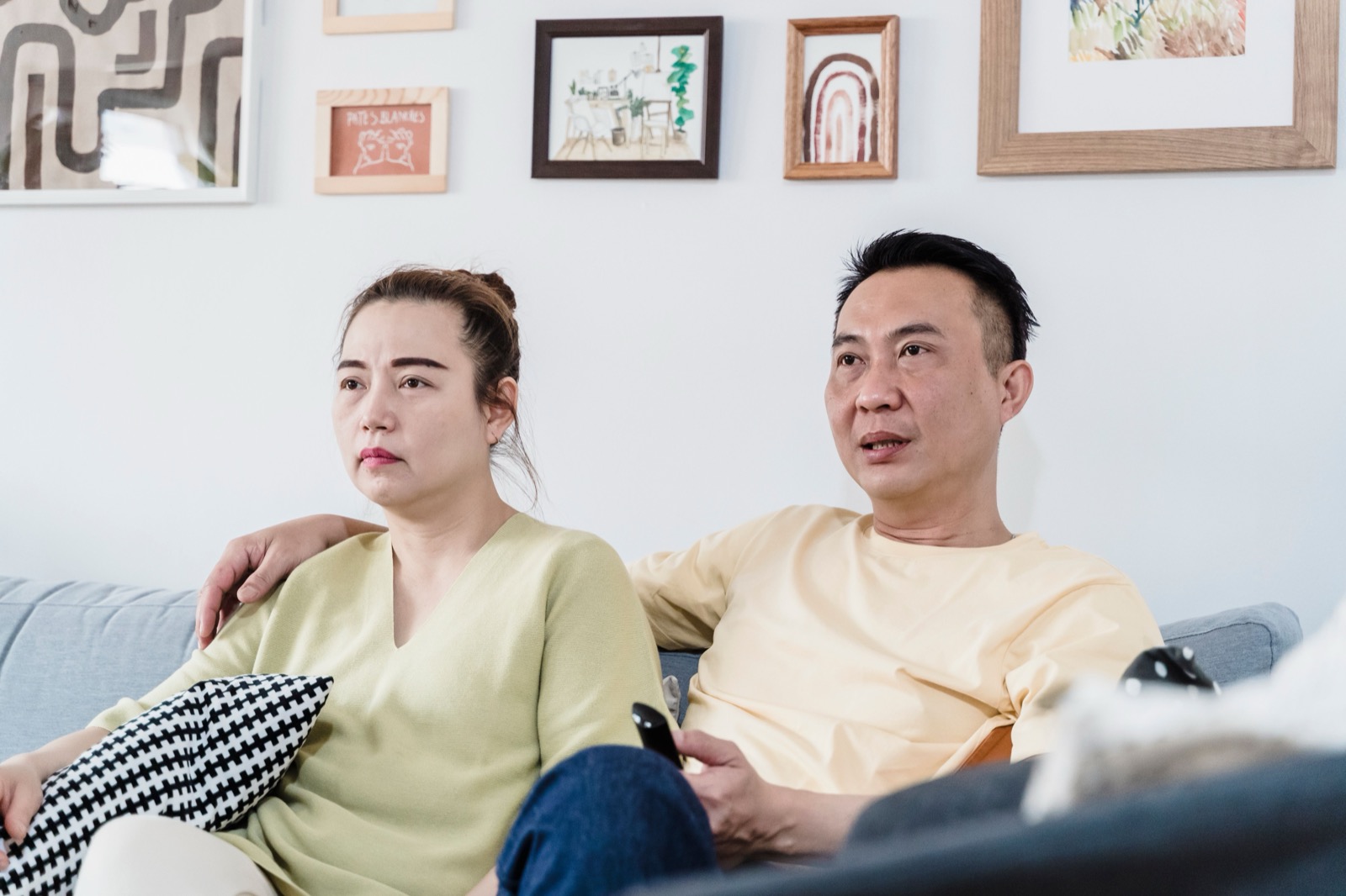 Family watching Necro IPTV on multiple devices including TV tablet and smartphone simultaneously
