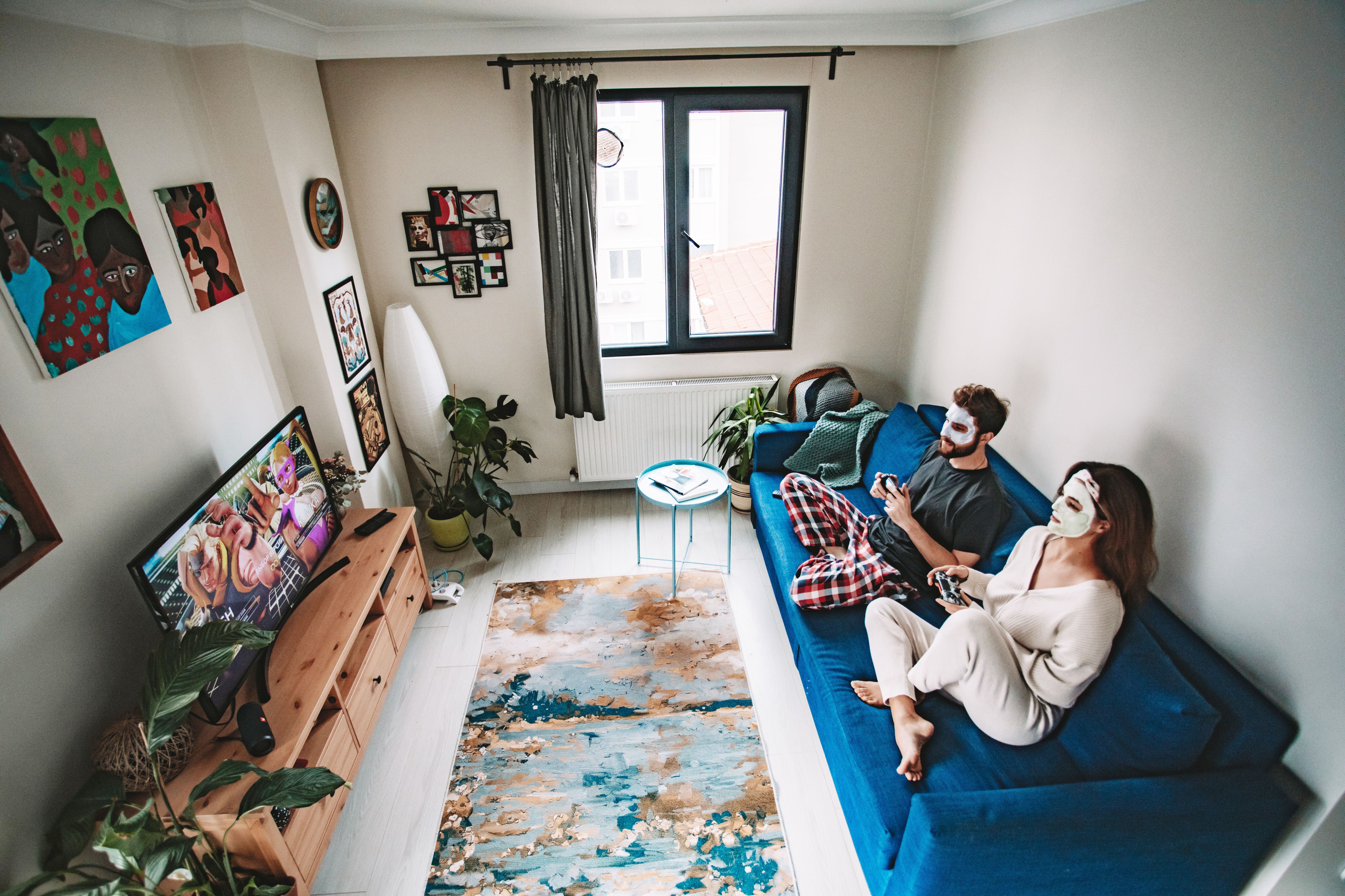 Family enjoying premium IPTV channels together on living room smart TV