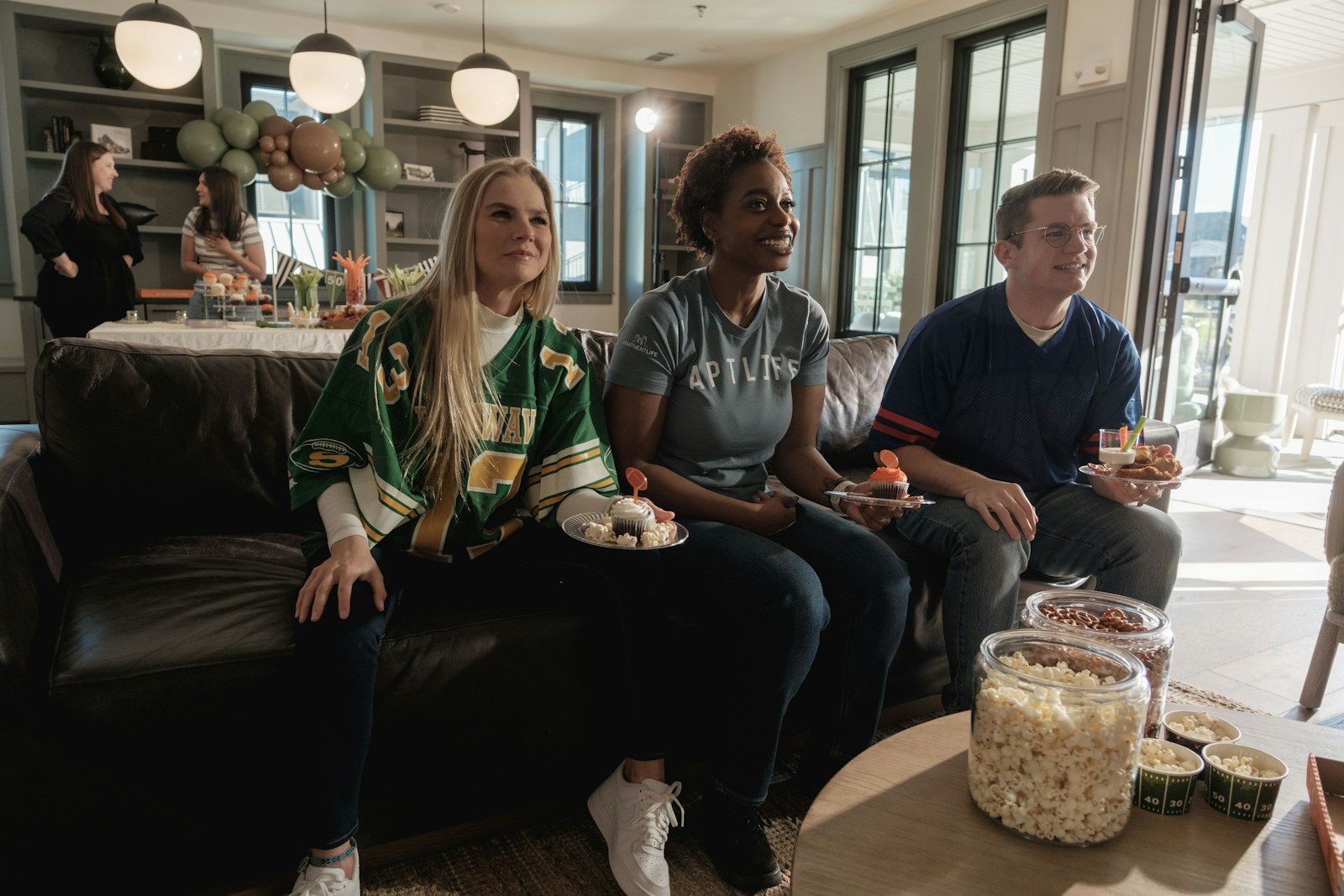 Friends watching live sports on IPTV at home